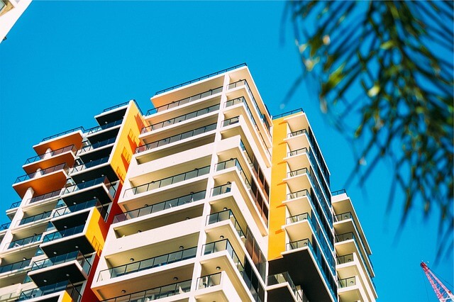 Balconies on a modern apartment building against a clear blue sky